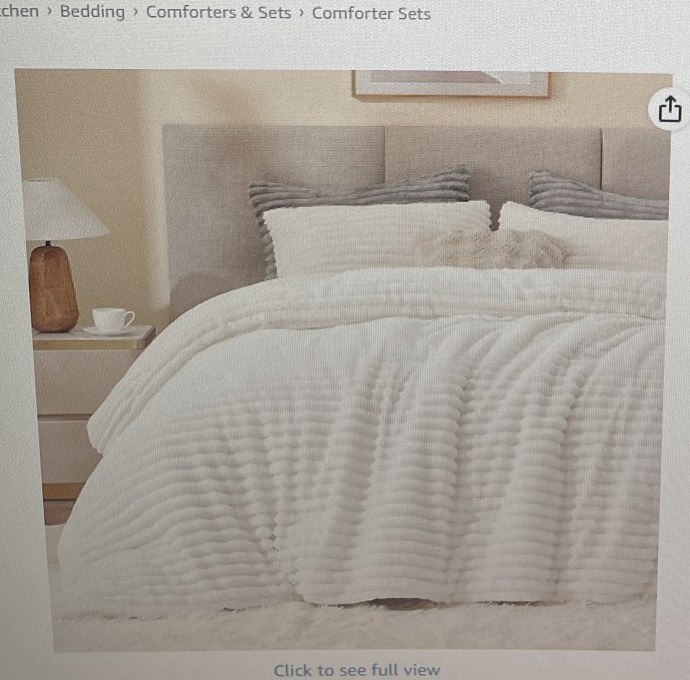 Cream BEDELITE fleece queen comforter on a bed