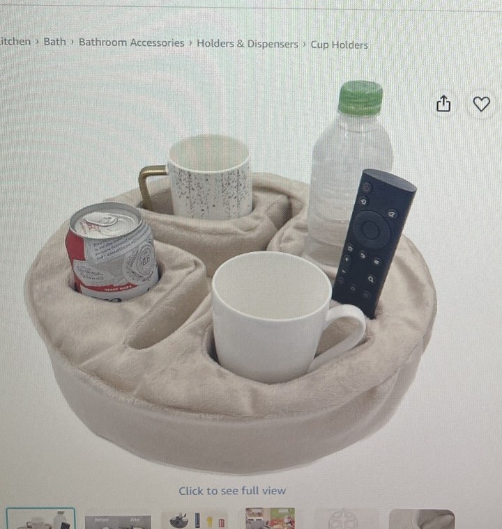 Beige Xchouxer couch caddy holding drinks and a remote
