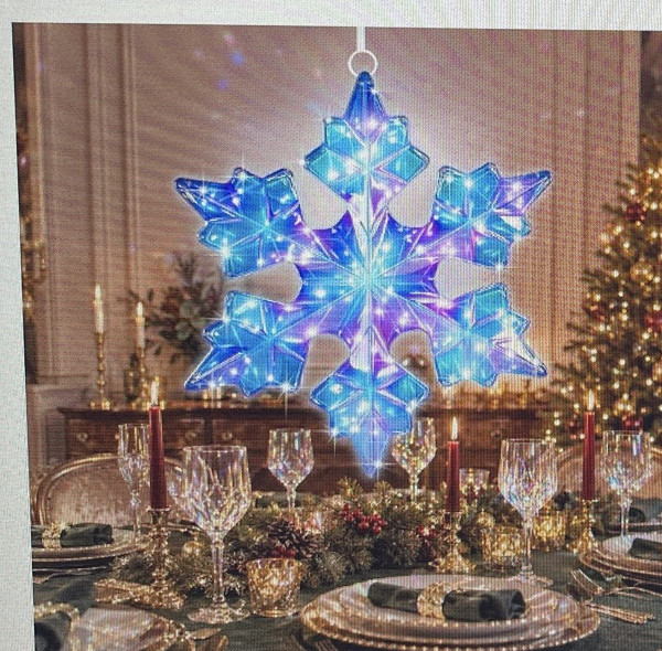 Two-piece prismatic iridescent pre-lit Christmas snowflake glowing blue and purple